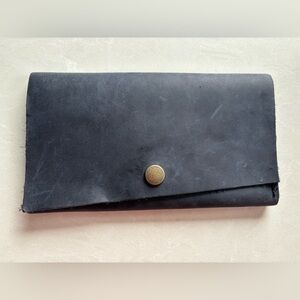 Portland leather goods trifold navy wallet with snap closure